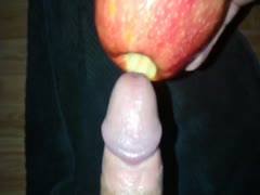 Man fucking an apple with his erected cock